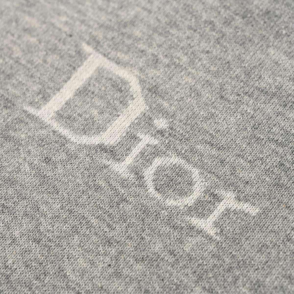 Christian Dior Small Logo Knit T-Shirt with Drop Shoulders and Short Sleeves for Minimalist Styling