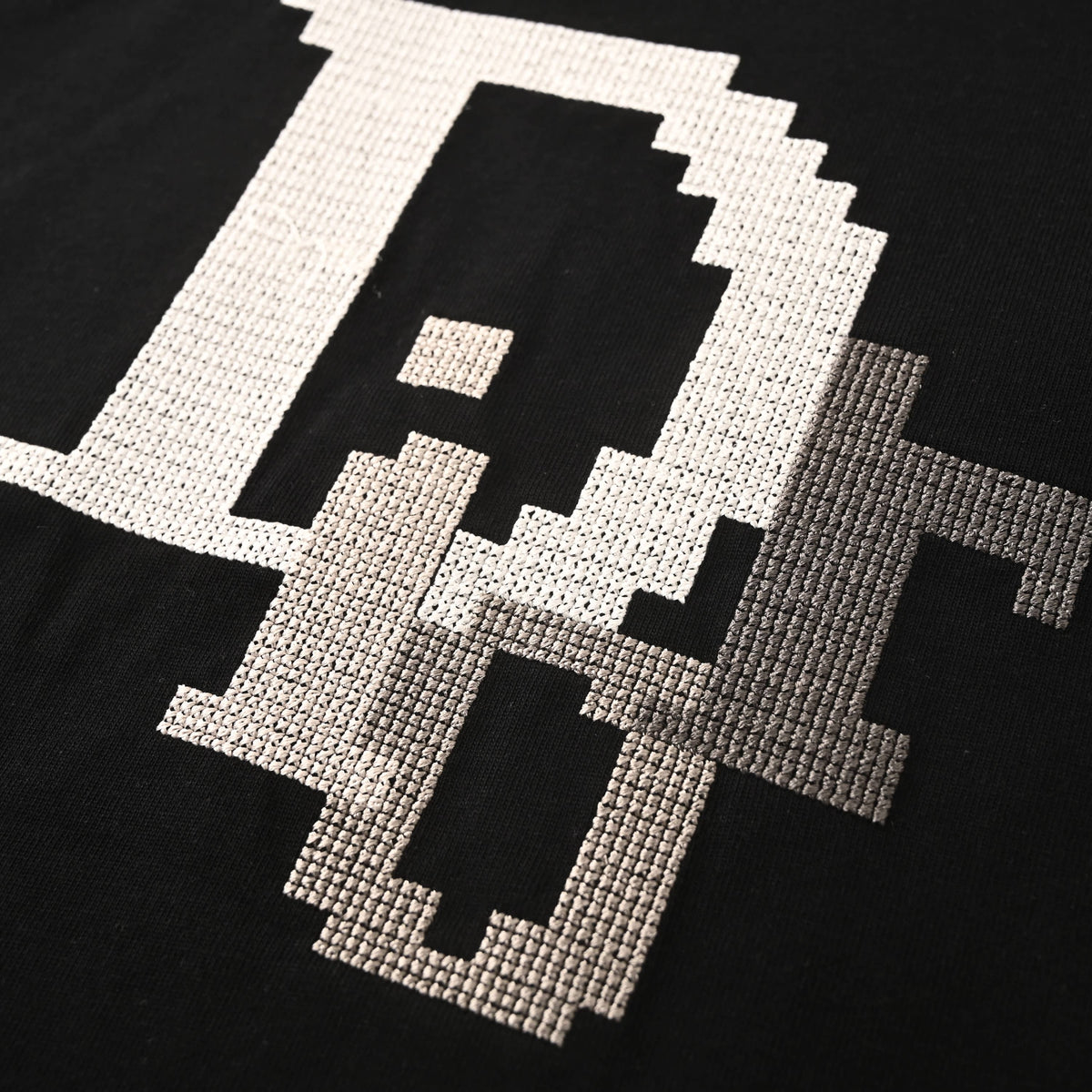 Christian Dior Cross-Stitch Logo Embroidered T-Shirt with Mosaic-Style Artwork and Classic Short Sleeves