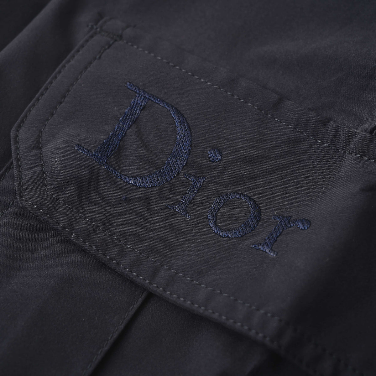 Christian Dior CD Letter Embroidered Utility Pants with Button Details for Workwear-Inspired Streetwear